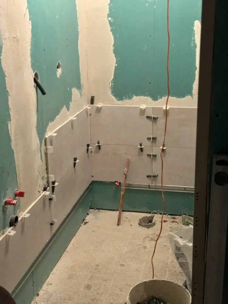 Precision ceramic tiling in a bathroom renovation