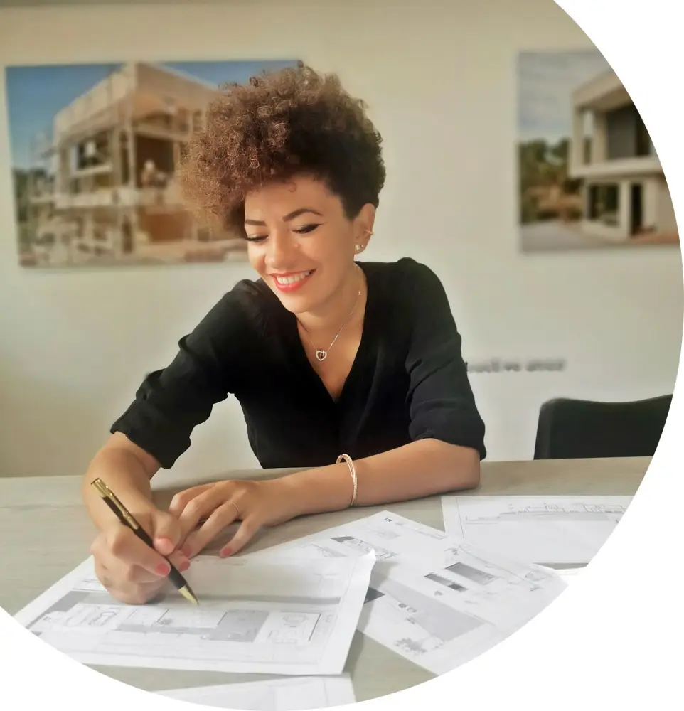 Coste Casa project planning in the office with drawings and client meeting table