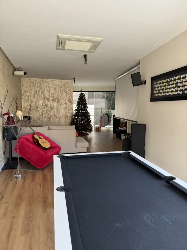 Home cinema and billiard room renovated by Coste Casa in Sitges